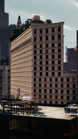 a tall skyscraper with many windows in a city skyline.