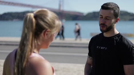 two sporty people talking after training.