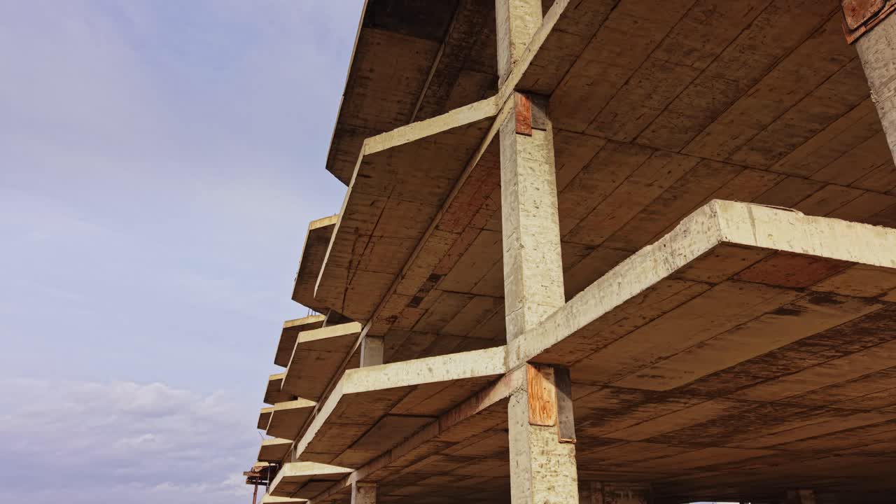 Building structure viewed from above showcases concrete details and sky