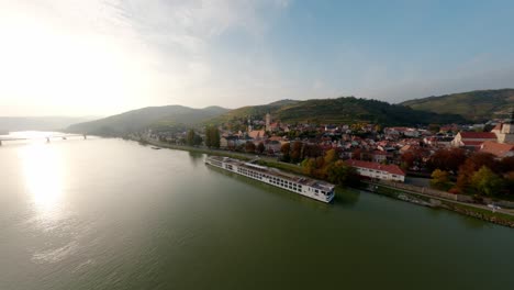 slow rotating aerial shot of the city stein an der donau with beautiful surrounding hills and nature