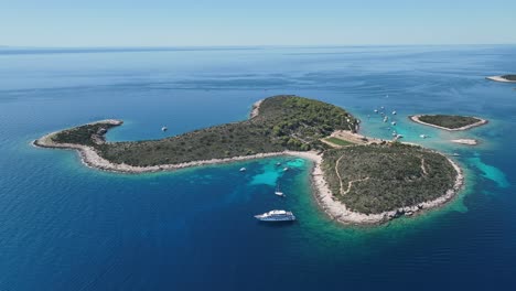 aerial drone video rotating around a small island in the adriatic sea in croatia