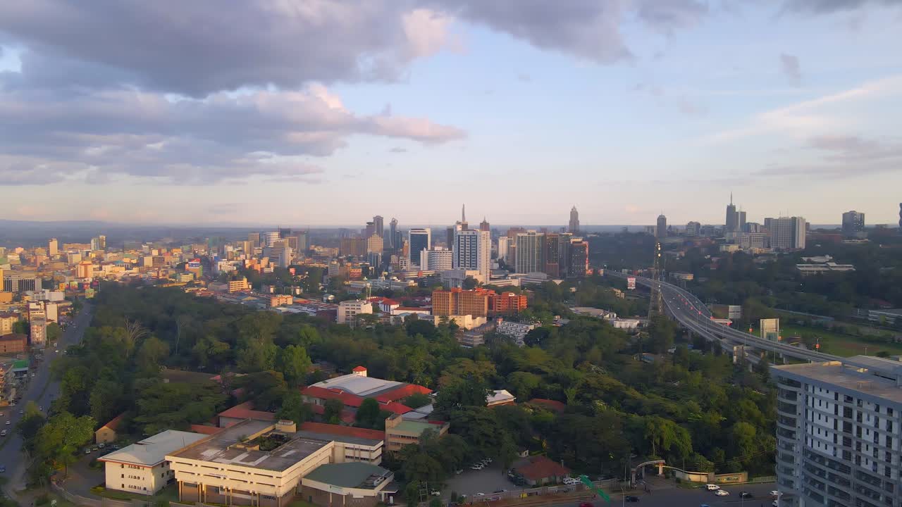 Nairobi Cityscape at Sunset. An aerial view of Nairobi, Kenya, showcasing its urban skyline during a vibrant sunset.