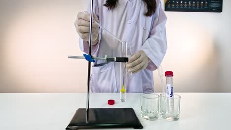 scientist conducts a bromothymol blue experiment, observing color changes in a laboratory setting with controlled lighting