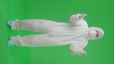 person in protective suit on green screen