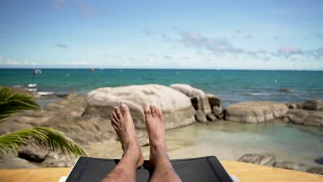 pov shot of relaxing on a sun lounger by the sea