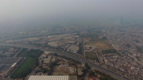 Long-aerial-view-of-city-with-building,-houses-and-a-highway,-Bbombay,-India