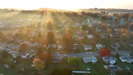 american neighborhood under fog illuminated by golden sunlight rays