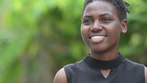 young happy beautiful african businesswoman thinking outdoors