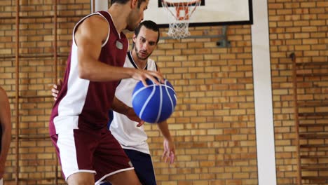 Basketball-players-playing-in-the-court