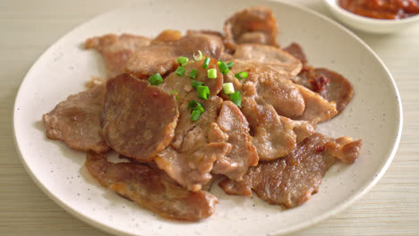 grilled pork neck sliced on plate in asian style