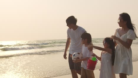 dad, mom and kid relax walking together near sea when sunset. 4k slow motion.