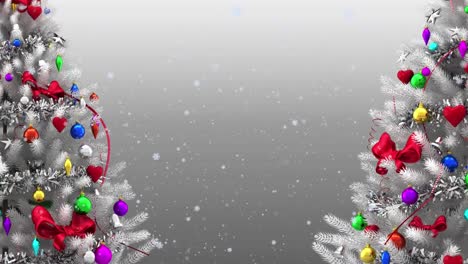 Animation-of-snow-falling-over-two-decorated-christmas-tree-against-copy-space-on-grey-background