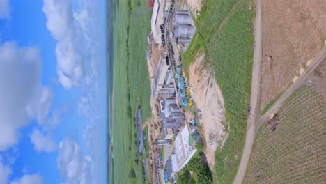 Vertical-Shot-Of-Barcelo-Rum-Factory-In-San-Pedro-De-Macoris,-Dominican-Republic---drone