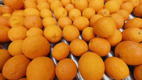 oranges rolling on grading and sorting machine in industrial packaging plant-2