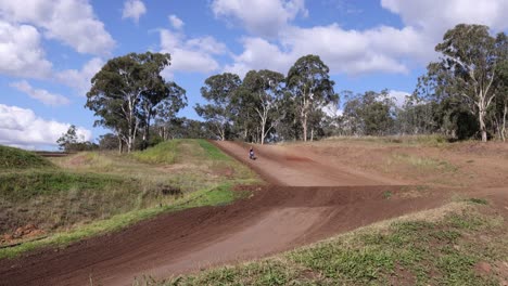 sequence of a motocross race in a countryside setting