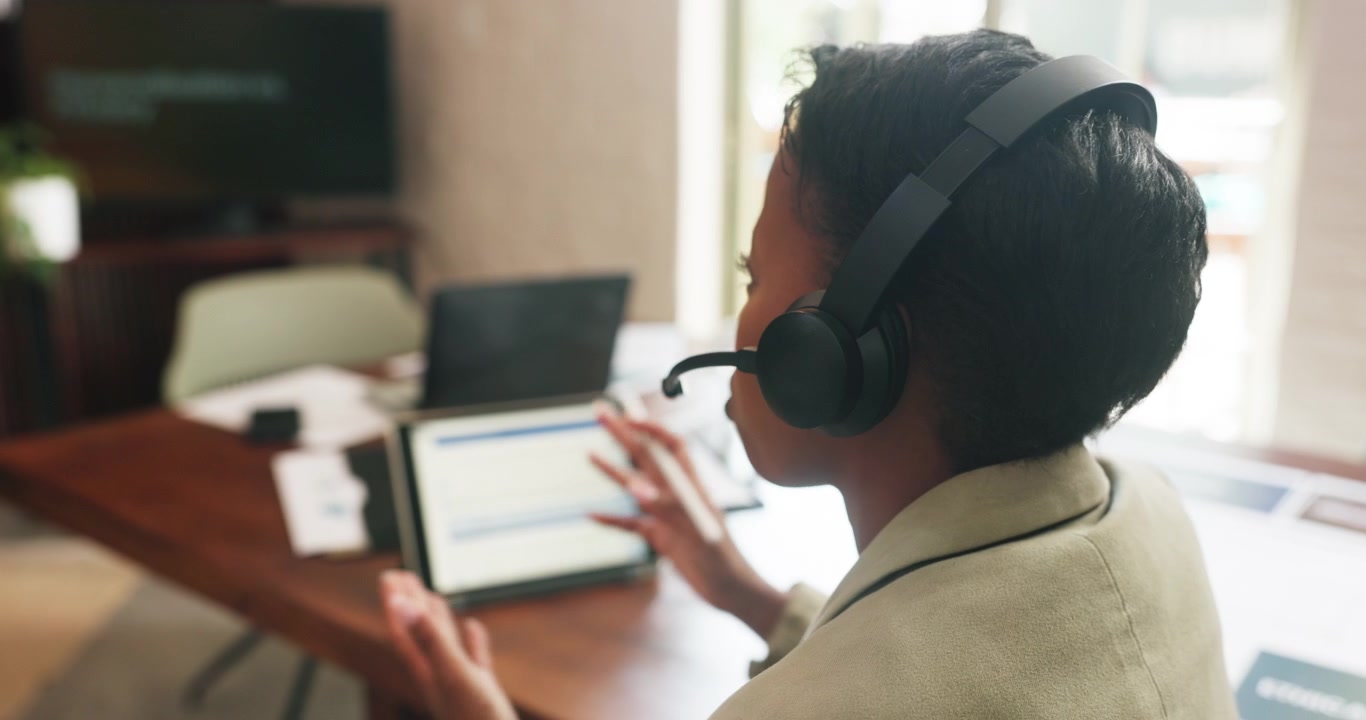 Professional Woman Participating in Video Conference Call at Office Desk