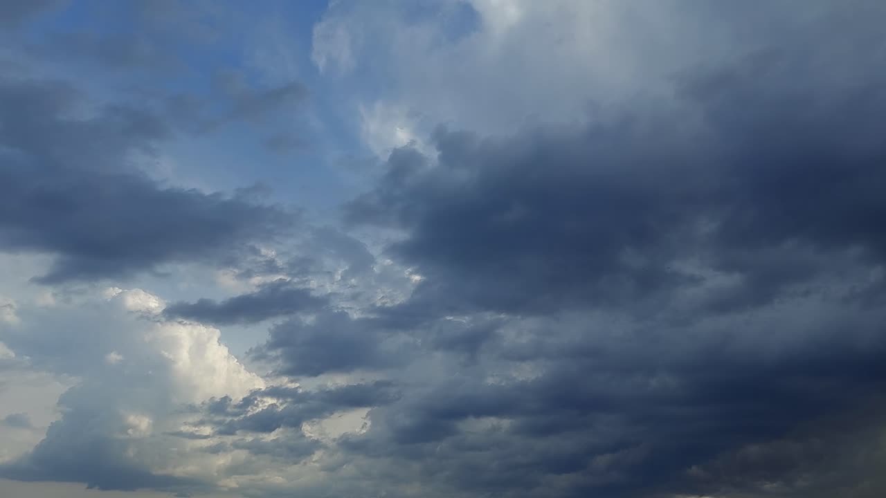 Storm clouds (Cumulonimbus) billowing and rolling through the sky, 4k time-lapse