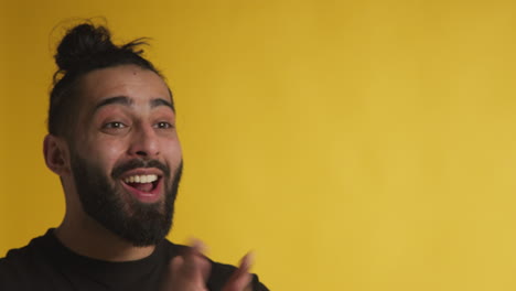 studio portrait of excited man celebrating good news winning money against black background 3