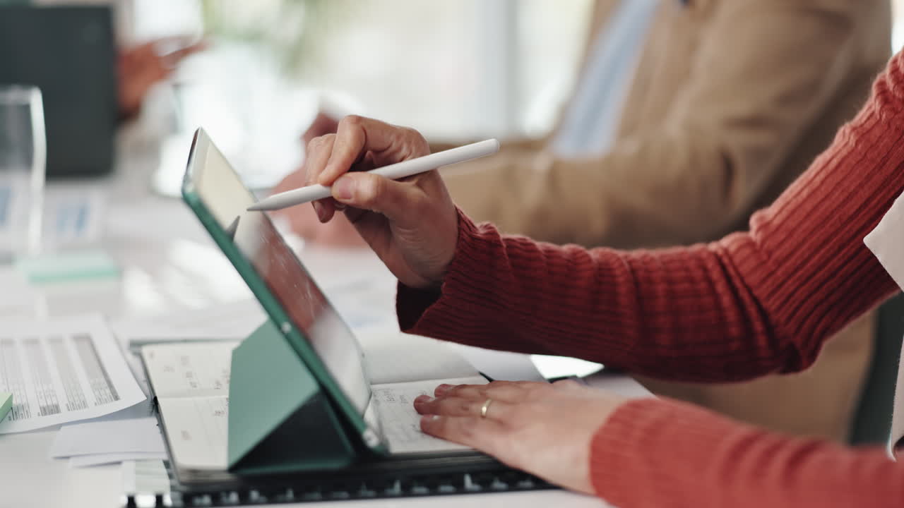 Business meeting with digital tablet and planner