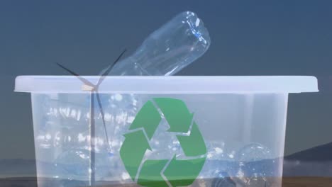 animación de un cartel de reciclaje verde sobre una caja con botellas de plástico y una turbina eólica