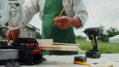 senior carpenter working outdoors