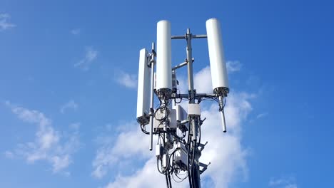time lapse with cloudy sky of telecom tower antennas and satellite transmits the signals of cellular 5g 4g mobile signals