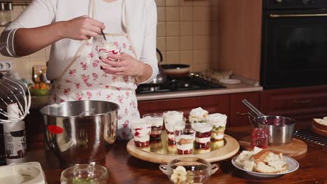 making layered desserts in the kitchen