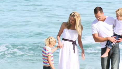 parents and children playing on the beach