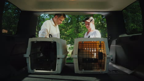 a man gets a dog in a cage signs for receipt pet delivery concept