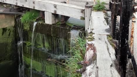 british canal system lock gates cascading water flood barrier closed gate dolly left