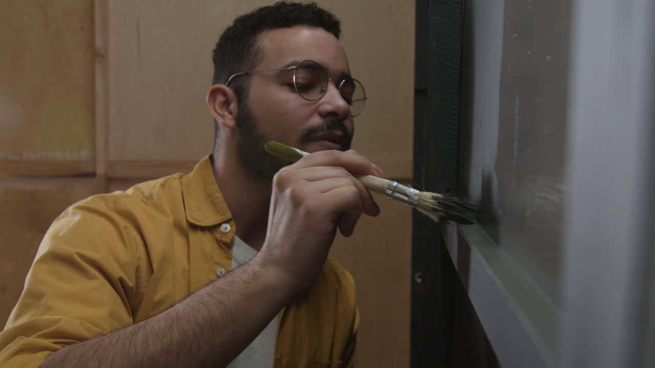 Man painting with a brush