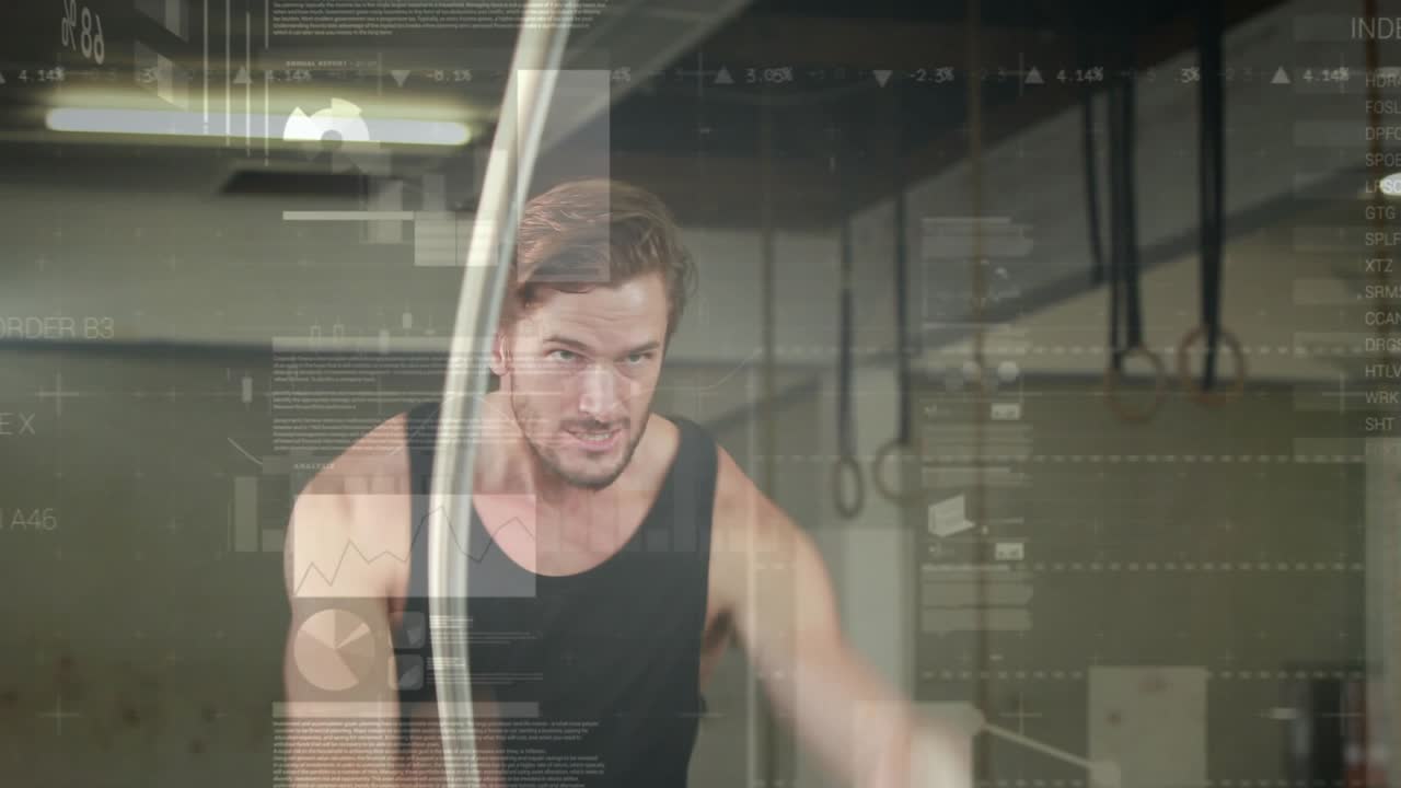 Male athlete gripping ropes, whipping larger faster waves in gym while HUD charts tracking fitness