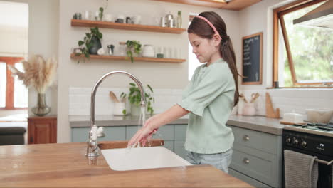 Child,-girl-washing-and-hands-with-soap-in-kitchen