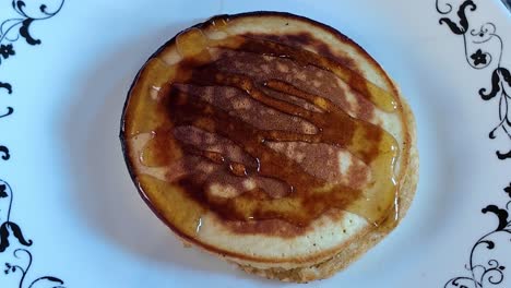 homemade pancake drizzled with rich syrup