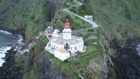 Establishing-shot-of-Farol-do-Arnel-cliff-lighthouse-Sao-Miguel-Azores-Portugal