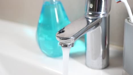 running water from bathroom faucet