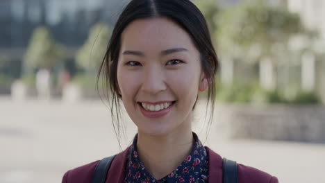 portrait happy young asian woman student laughing enjoying relaxed urban lifestyle in city beautiful independent girl sunny outdoors