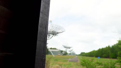 radio telescope array in a forest landscape