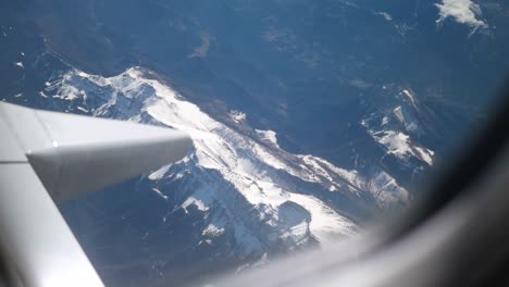 view of european alps from airplane window