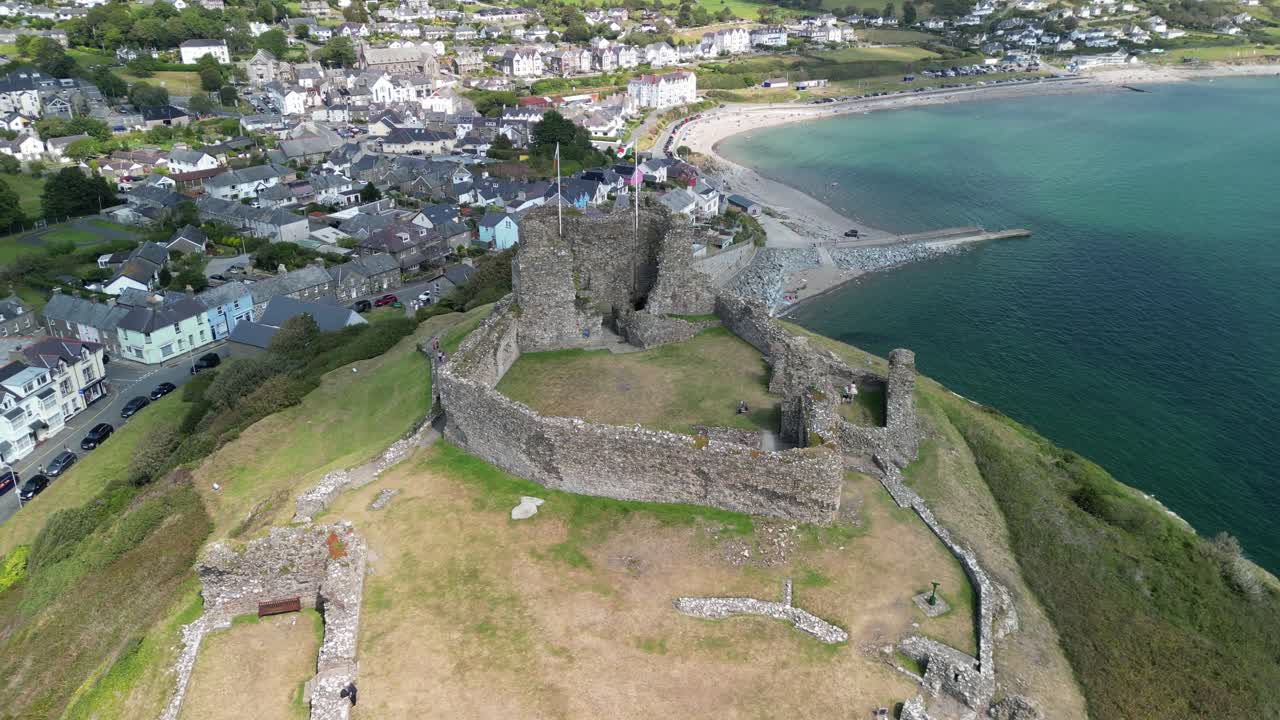 Stunning Criccieth Castle on a lovely summer afternoon - aerial drone slow approach from above - North Wales, UK