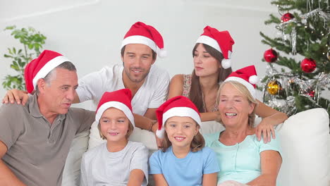 Happy-family-at-christmas-holding-gifts-