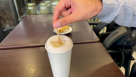 sugar mixing in a cup of coffe