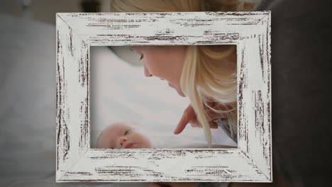 animation of frame over caucasian mother talking to baby