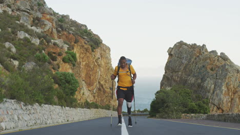 Sporty-mixed-race-man-with-prosthetic-leg-hiking