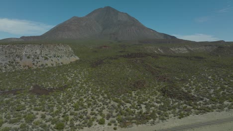 tilt-up aerial reveal of tres virgenes volcano mountain in mexico