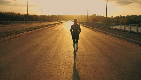 amazing-slow-motion-shot-with-running-sportswoman-in-sunset-or-sunrise-lady-in-sportswear-is-jogging