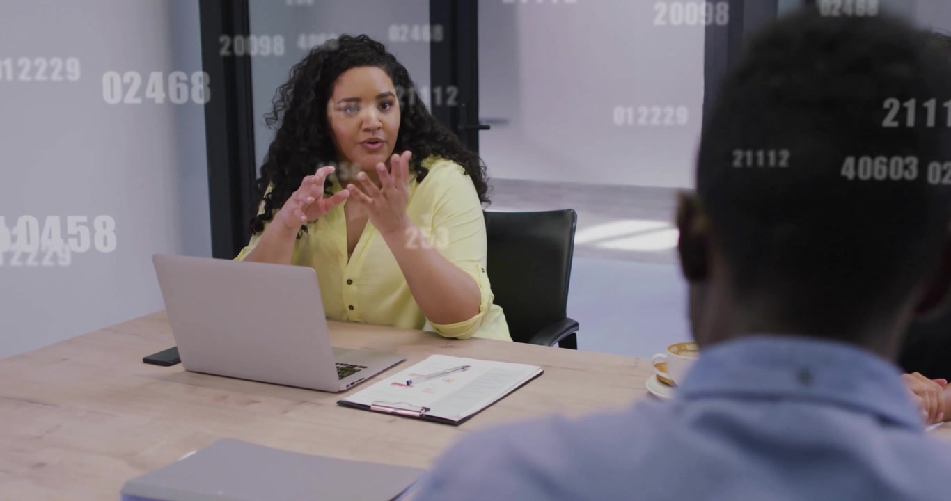 Animation of data processing over diverse business people discussing work