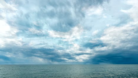 4k time lapse of the sea and blue sky, white clouds evolve and change shape, dynamic weather, beautiful seascape, video loop