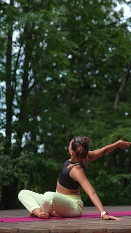 woman practicing yoga outdoors