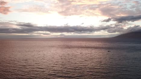 aerial flyover shot of a sunset in maui  hawaii